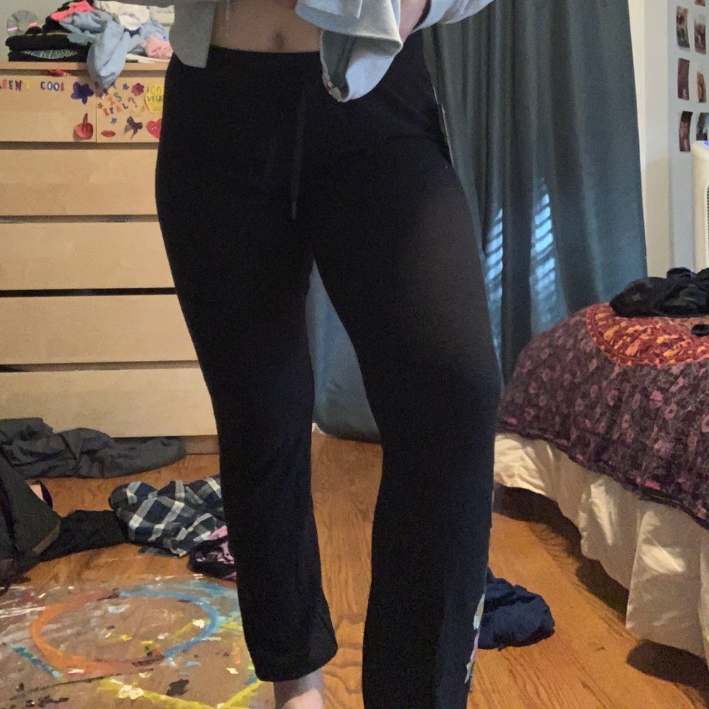 Black joggers with flower detail